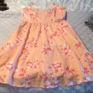 Short strappy summer dress with pockets.